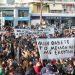 people gathered in the streets in a rally
